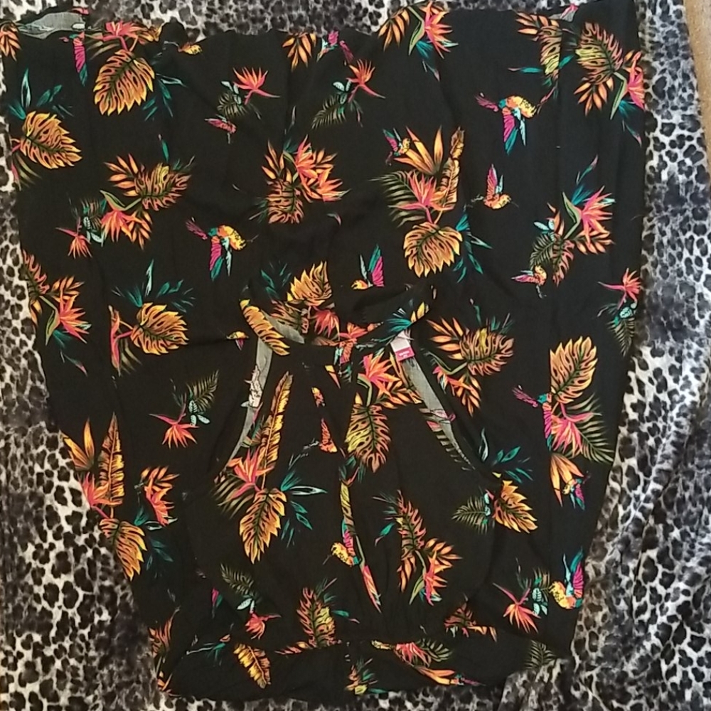 Super cute romper with a skirt.